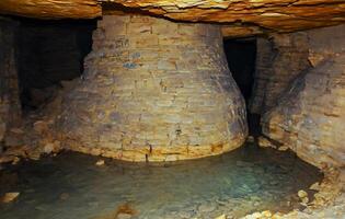 Fortifications in the form of round pear-shaped pillars made of saw shell rock in the Odessa catacombs photo