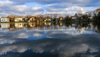 Natural Landscape, Reflection of clouds and lodges in the water of a quiet lake in New Jersey photo