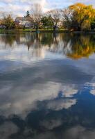 Natural Landscape, Reflection of clouds and lodges in the water of a quiet lake in New Jersey photo
