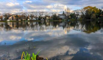 Natural Landscape, Reflection of clouds and lodges in the water of a quiet lake in New Jersey photo