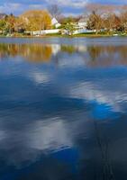 Natural Landscape, Reflection of clouds and lodges in the water of a quiet lake in New Jersey photo