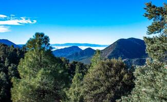 Beautiful mountain scenery on the background of clouds, layers of mountains on the horizon, Sierra Nevada Mountains, California, USA photo