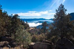 Beautiful mountain scenery on the background of clouds, layers of mountains on the horizon, Sierra Nevada Mountains, California, USA photo