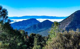Beautiful mountain scenery on the background of clouds, layers of mountains on the horizon, Sierra Nevada Mountains, California, USA photo