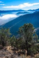 Beautiful mountain scenery on the background of clouds, layers of mountains on the horizon, Sierra Nevada Mountains, California, USA photo