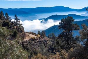 Beautiful mountain scenery on the background of clouds, layers of mountains on the horizon, Sierra Nevada Mountains, California, USA photo