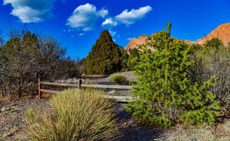 A wooden fence with a shadow from the sun, Garden of the Gods, US photo