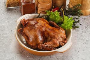 Baked small chicken with spices photo