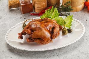 Baked small chicken with spices photo