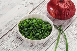 Diced green onion in the bowl photo