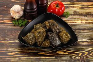 Stuffed dolma - meat in grape leaves photo