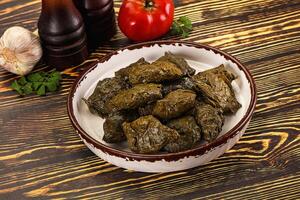 Stuffed dolma - meat in grape leaves photo