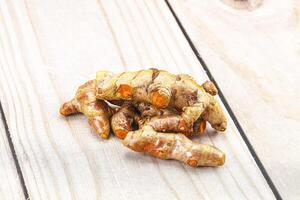 Fresh young Tumeric root heap photo
