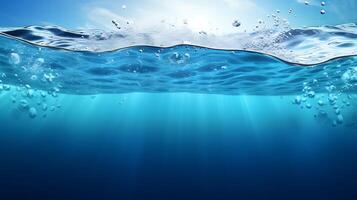 Split view of a clear blue sea with a calm water surface ocean with sunrays photo