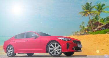 Red car on a background of palm trees. Stylish, modern, bright image of the car for design solutions. photo