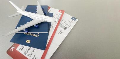 Top view of traveler accessories, passports and air tickets on background with copy space for text. Travel vacation concept photo