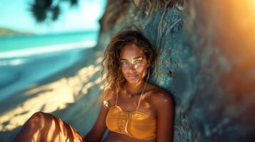 Beautiful Bohemian Styled Woman Enjoying Sunlight on a Tropical Beach photo