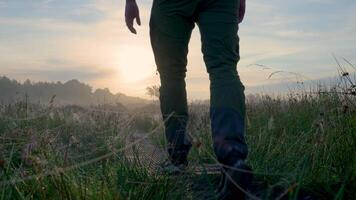 a man walking on a trail in the fog video
