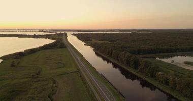 an aerial view of a highway and a lake video