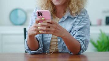 Close-up of women hands using mobile phone, typing text on her smartphone, browsing websites, surfing the internet, networking. Online communication video