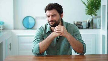 Emotional portrait of an anxious young Caucasian bearded man having mental and psychological problems, experiencing stress, burnout and demotivation due to business problems. video