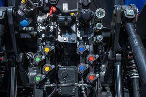 detail of connectors on the rear of a modern tractor, mechanical concept photo