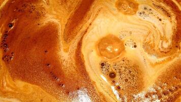 The foam of the espresso just out of the valve of the machine. photo