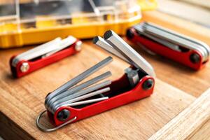 Hand tools,Folding Hex Key Set on desk. Folding Hex Key design for slipping in pocket or for easy storage. photo