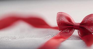 Elegant red satin and intricate lace fabric draped together on a dark background photo