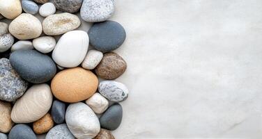 Smooth stones arranged on light surface for decorative purposes photo