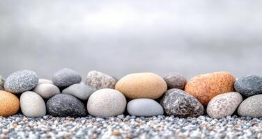 Smooth stones arranged on light surface for decorative purposes photo
