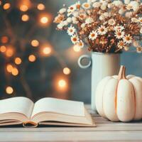 Cozy Reading Corner With Open Book, Autumn Decor, Tea, and Dried Flowers photo