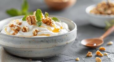 Creamy Yogurt Bowl With Honey and Nuts on Rustic Table photo