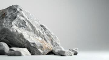 Gray Rock on a Soft Surface Against Blurred Mountain Background at Dusk photo