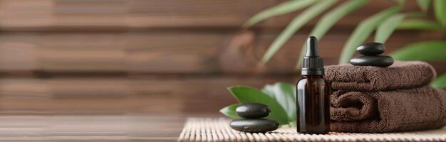 Essential Oil Bottle and Stones on Bamboo Mat in Relaxing Spa Setting photo