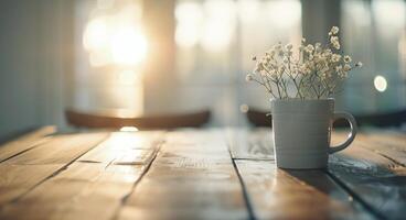Small Potted Plant on Wooden Table Bathed in Warm Sunset Light photo