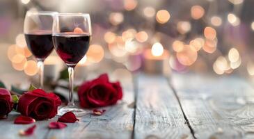 Romantic Setting With Red Wine Glasses and Roses on Rustic Wooden Table photo