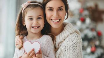 Happy Mother and Daughter Smiling in a Park With Heart-Shaped Pillow in Spring Sunshine photo