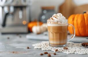 Warm Pumpkin Spice Latte With Whipped Cream and Cinnamon in Cozy Autumn Setting photo
