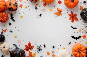Autumn Halloween Decoration With Pumpkins, Bats, and Spiders On White Background photo