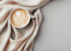 Freshly Brewed Coffee in White Cup on Soft Linen Tablecloth photo