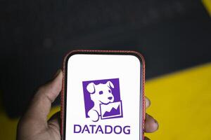 Dhaka, Bangladesh, 11 Aug 2024- DataDog logo is displayed on smartphone. Datadog is a SaaS platform that monitors cloud applications. photo