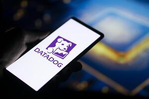 Dhaka, Bangladesh, 11 Aug 2024- DataDog logo is displayed on smartphone. Datadog is a SaaS platform that monitors cloud applications. photo