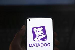 Dhaka, Bangladesh, 11 Aug 2024- DataDog logo is displayed on smartphone. Datadog is a SaaS platform that monitors cloud applications. photo