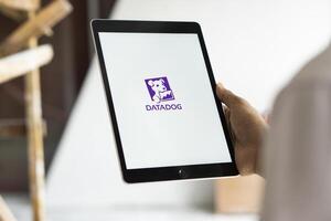 Dhaka, Bangladesh, 11 Aug 2024- DataDog logo is displayed on iPad. Datadog is a SaaS platform that monitors cloud applications. photo