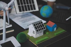 Carbon offset price report CO2 emission. Future growth Net zero waste in ESG ethical SME office protect climate change global warming social issues project. Group of asia people Eco friendly SDGs plan photo