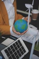 Carbon offset price report CO2 emission. Future growth Net zero waste in ESG ethical SME office protect climate change global warming social issues project. Group of asia people Eco friendly SDGs plan photo