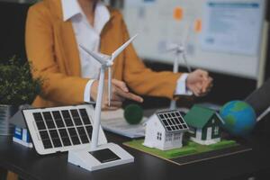 Carbon offset price report CO2 emission. Future growth Net zero waste in ESG ethical SME office protect climate change global warming social issues project. Group of asia people Eco friendly SDGs plan photo