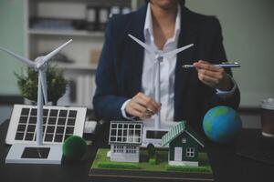 Carbon offset price report CO2 emission. Future growth Net zero waste in ESG ethical SME office protect climate change global warming social issues project. Group of asia people Eco friendly SDGs plan photo