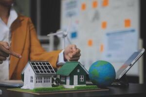 Carbon offset price report CO2 emission. Future growth Net zero waste in ESG ethical SME office protect climate change global warming social issues project. Group of asia people Eco friendly SDGs plan photo